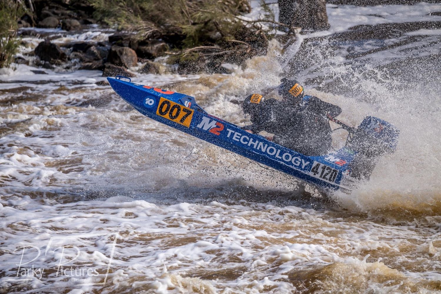The 007 boat nose-up in heavy spray during the Avon Descent